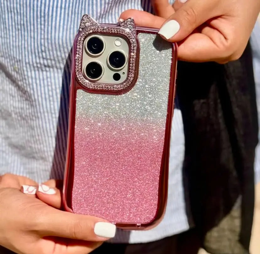 Phone case with cat ears held by hands against a blurred background